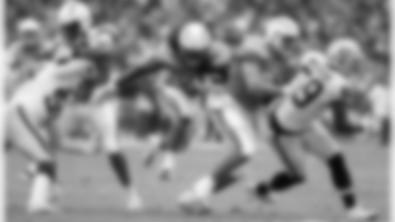 Melvin Gordon breaks through to run the ball downfield during the Week 5 matchup against the Oakland Raiders at ROKiT Field at StubHub Center.