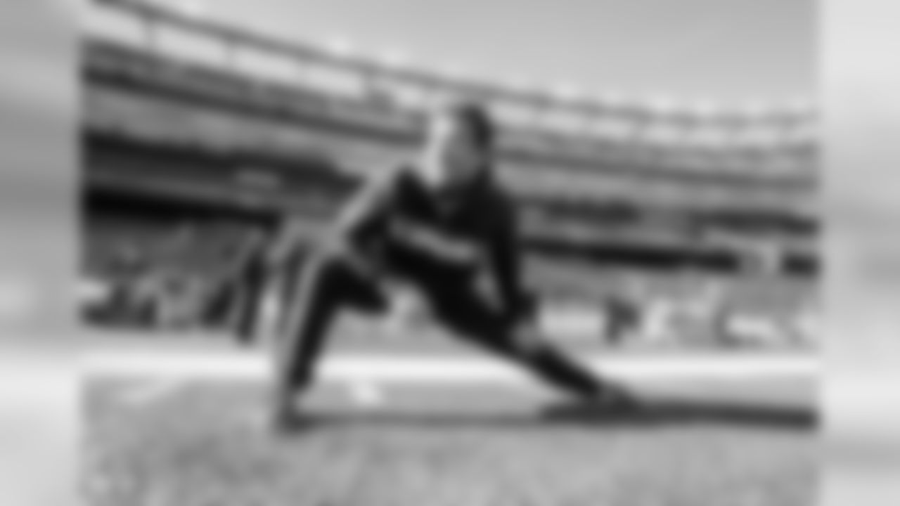 Nick Dzubnar stretches before the Divisional Round matchup against the New England Patriots at Gillette Stadium.