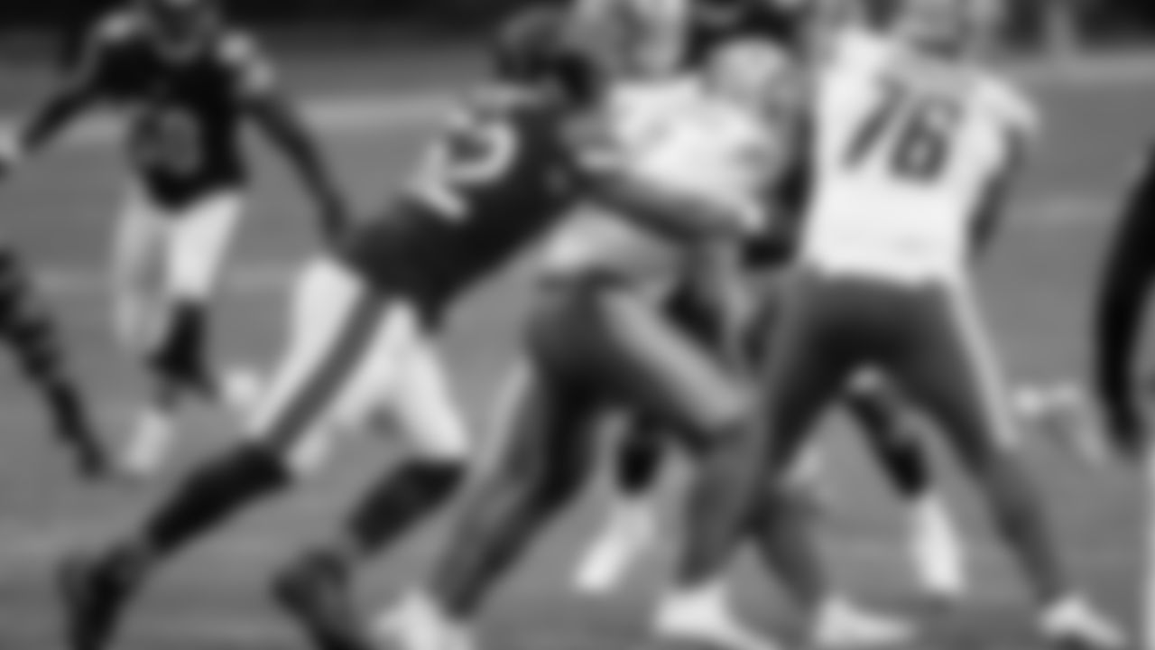 Chicago Bears outside linebacker Khalil Mack (52) sacks Detroit Lions quarterback Matthew Stafford (9)] in the first half of an NFL football game in Chicago, Sunday, Dec. 6, 2020. (AP Photo/Nam Y. Huh)