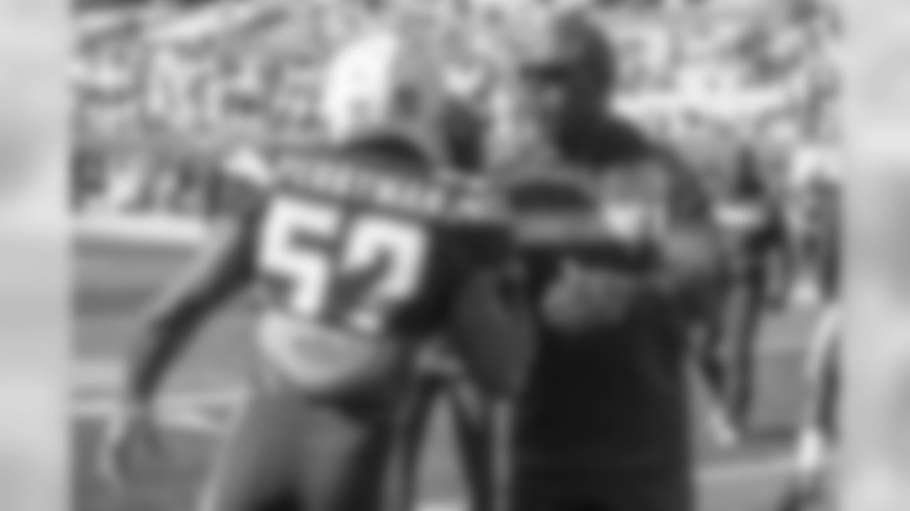 Denzel Perryman and Head Coach Anthony Lynn shake hands before the Bolts take on the Browns at FirstEnergy Stadium.