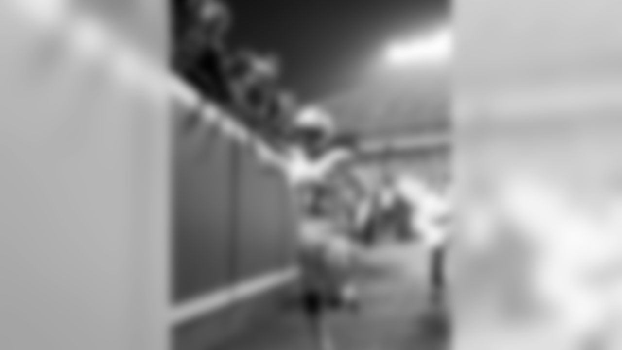 Travis Benjamin runs back to the locker room after warming up at Arrowhead Stadium before the Thursday night matchup against the Kansas City Chiefs.