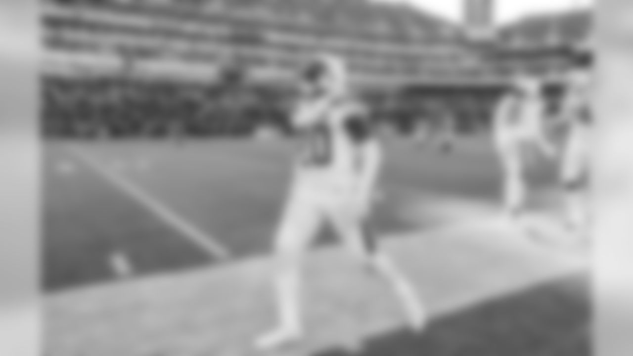 Desmond King celebrates his 72-yard kick return during the Wild Card matchup against the Baltimore Ravens at M&T Bank Stadium.