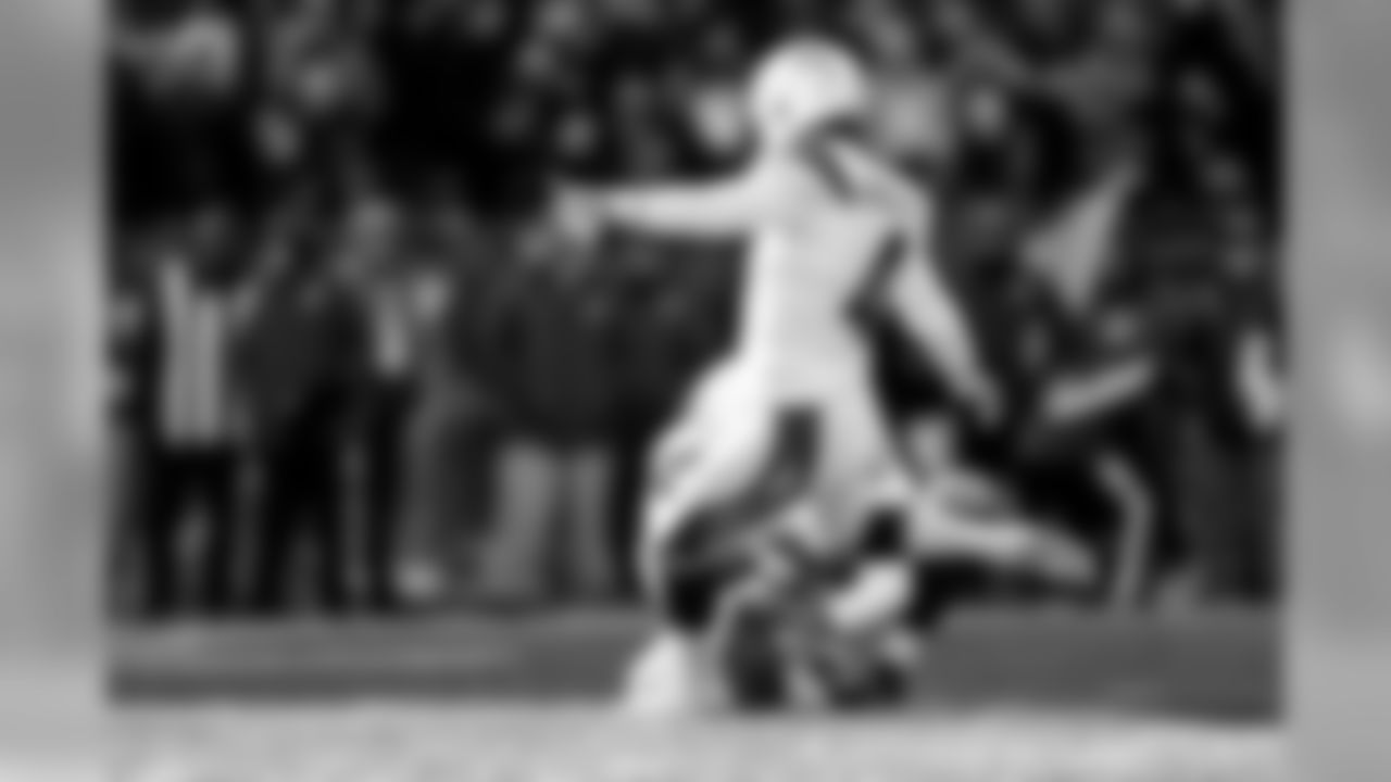 Michael Badgley kicks an extra point during the Divisional Round matchup against the New England Patriots at Gillette Stadium.