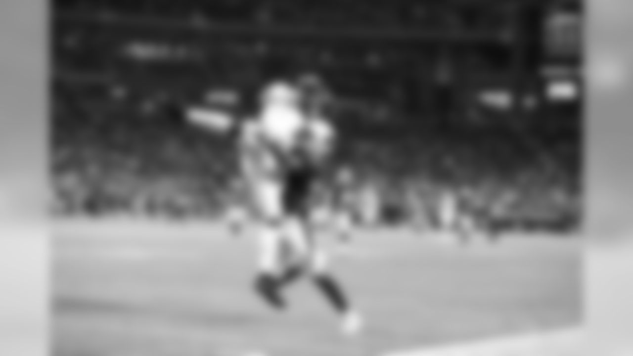 Geremy Davis makes a leaping catch before running in a touchdown during the Chargers' first preseason game versus the Arizona Cardinals.