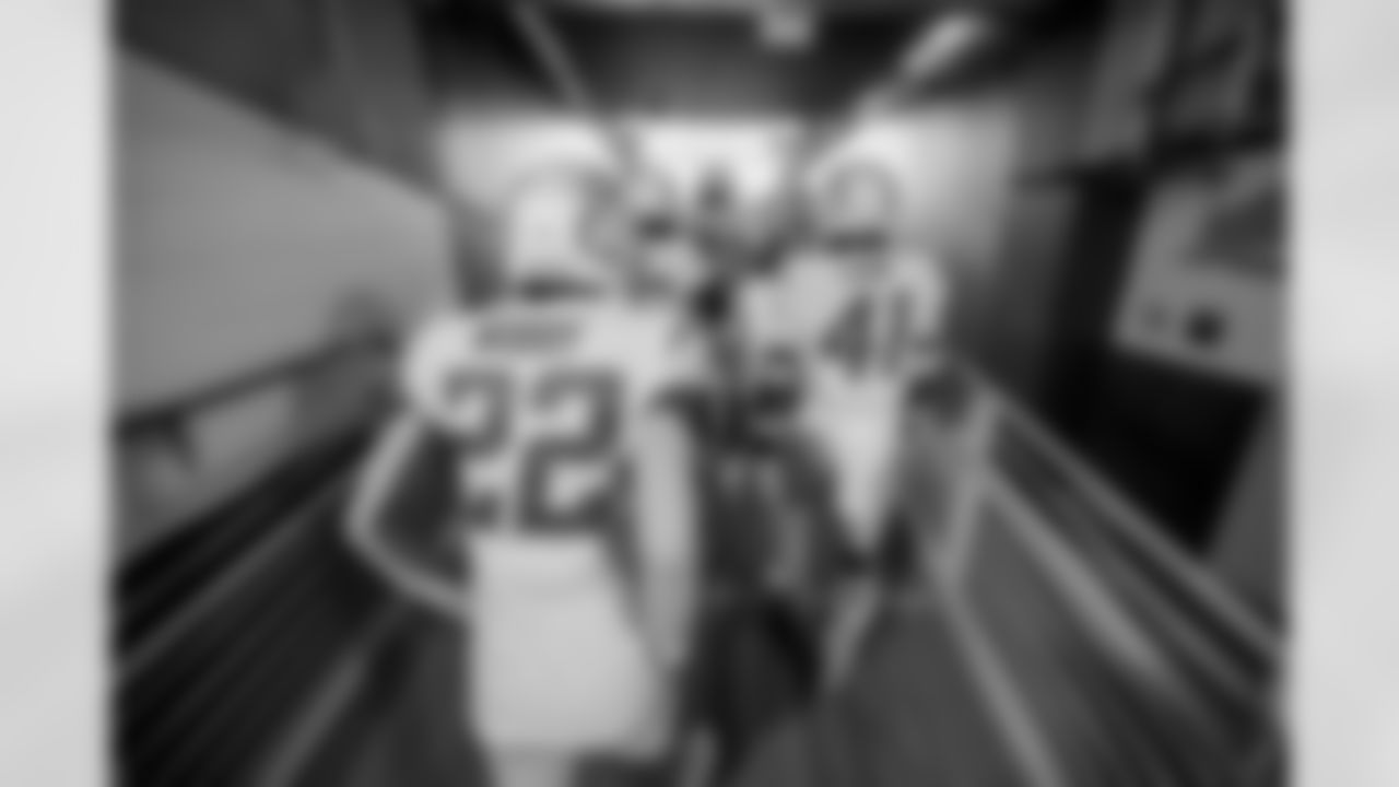 The Los Angeles Chargers prepare to play against the Arizona Cardinals at State Farm Stadium on November 27, 2022 in Glendale, Arizona.