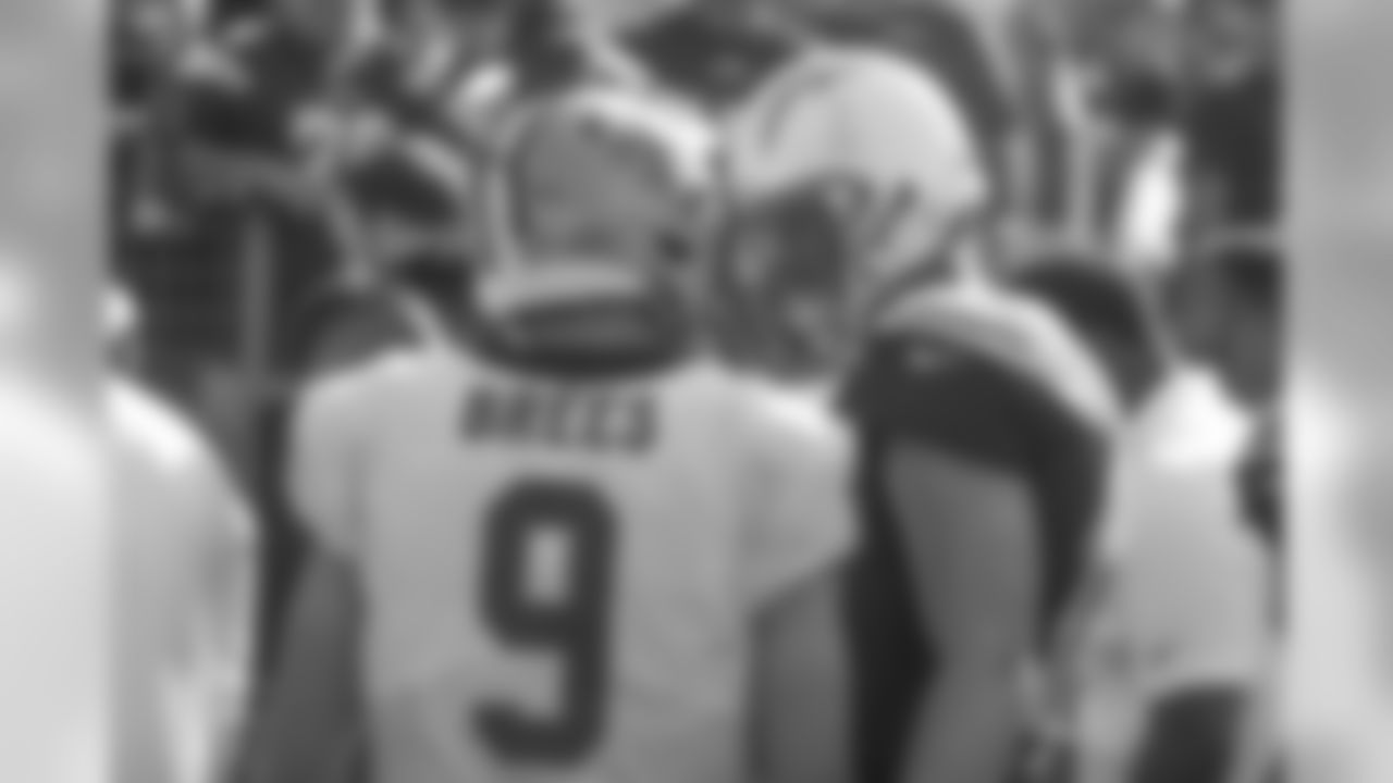 Drew Brees and Philip Rivers share a smile before the Chargers and Saints face off at ROKiT Field at StubHub Center.