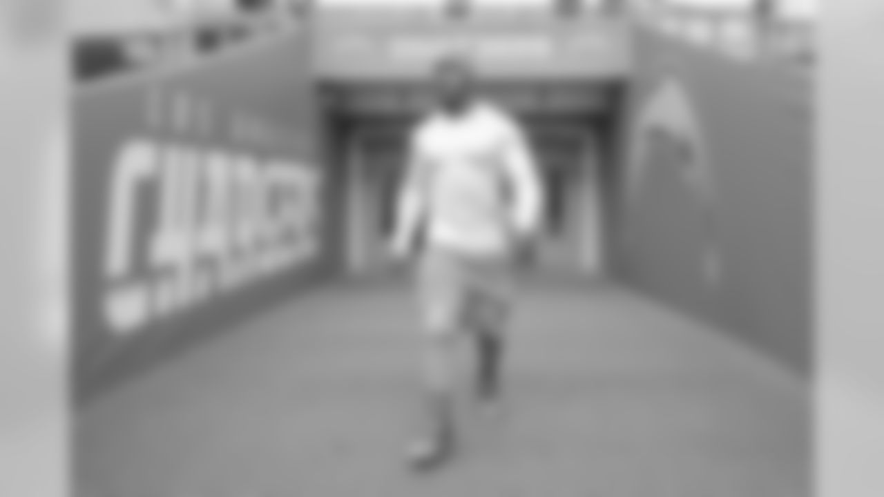Denzel Perryman walks out to warm up at Wembley Stadium in London before the Week 7 matchup against the Tennessee Titans.
