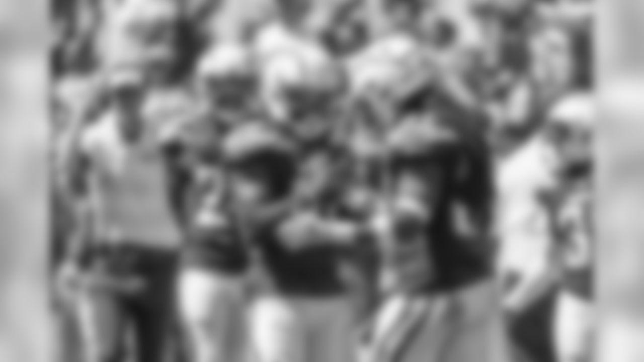 Desmond King and Jahleel Addae celebrate King's forced fumble during the Bolts' matchup against the LA Rams at the LA Memorial Coliseum.