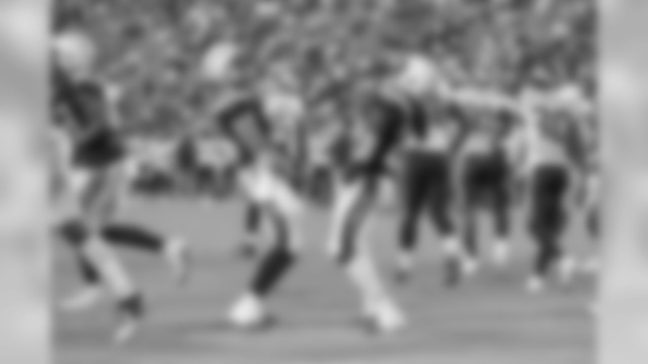 Derek Watt and Melvin Gordon celebrate during the Chargers' preseason home opener against the Seattle Seahawks at ROKiT Field at StubHub Center.