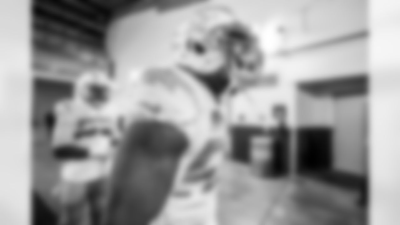 The Los Angeles Chargers prepare to play against the Arizona Cardinals at State Farm Stadium on November 27, 2022 in Glendale, Arizona.