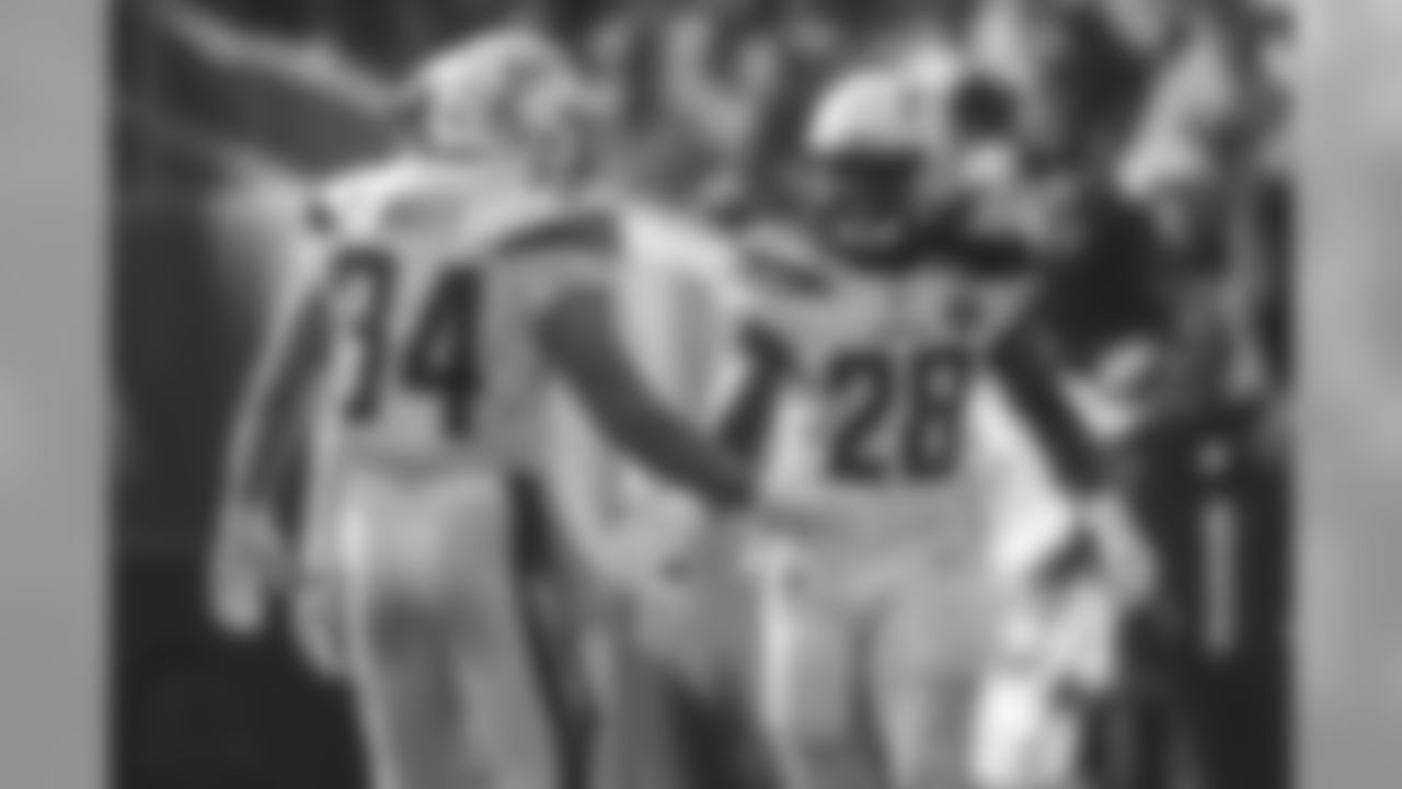 Derek Watt and Melvin Gordon slap hands after Gordon's touchdown during the Week 10 matchup against the Oakland Raiders at Oakland-Alameda County Coliseum.