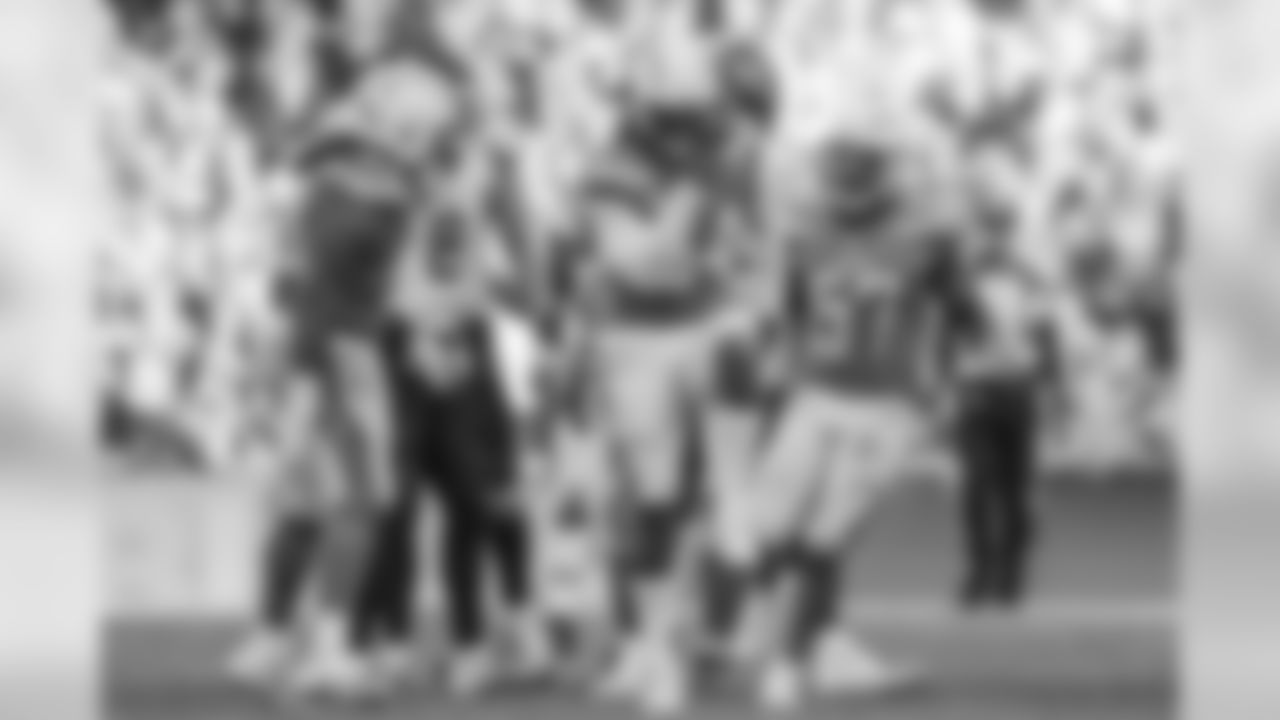 Melvin Ingram celebrates sacking Marcus Mariota during the Week 7 contest against the Tennessee Titans at Wembley Stadium in London.