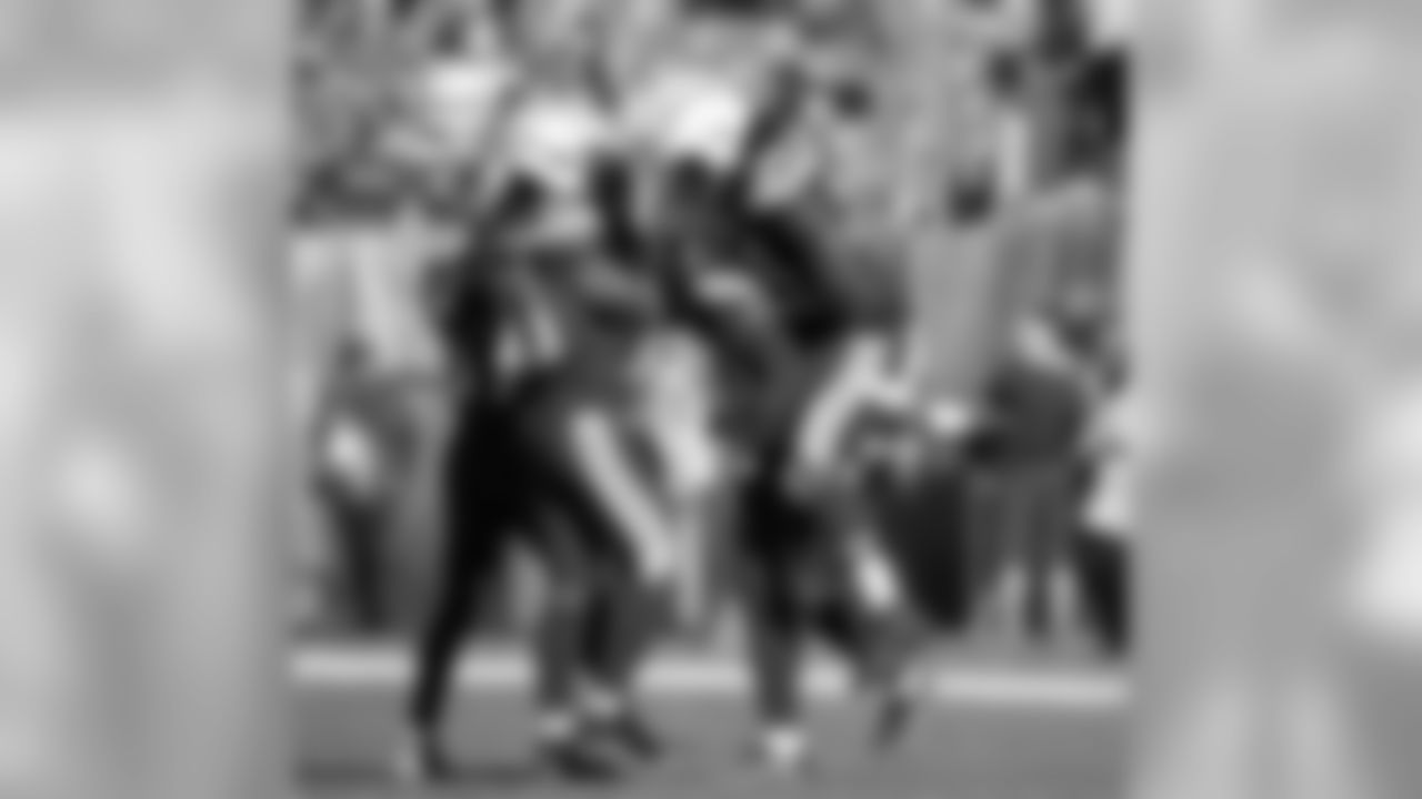 Jahleel Addae, Rayshawn Jenkins and Melvin Ingram celebrate with Desmond King after King's second interception of the day during the Week 6 matchup against the Cleveland Browns.