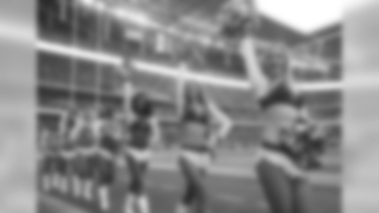 Cheerleaders wave to spectators before an NFL football game between Tennessee Titans and Los Angeles Chargers at Wembley stadium in London, Sunday, Oct. 21, 2018. (AP Photo/Matt Dunham)