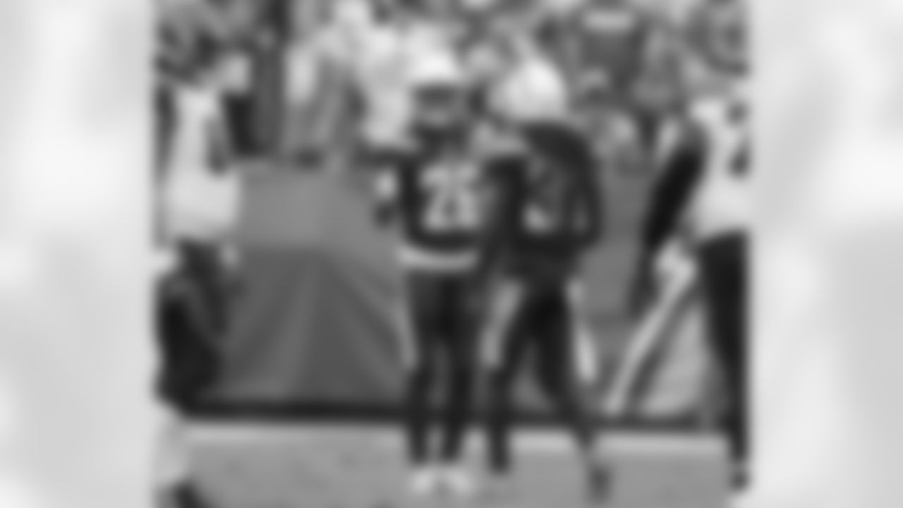 Jahleel Addae and Casey Hayward celebrate on the field during the Week 14 matchup against the Cincinnati Bengals at ROKiT Field at StubHub Center.