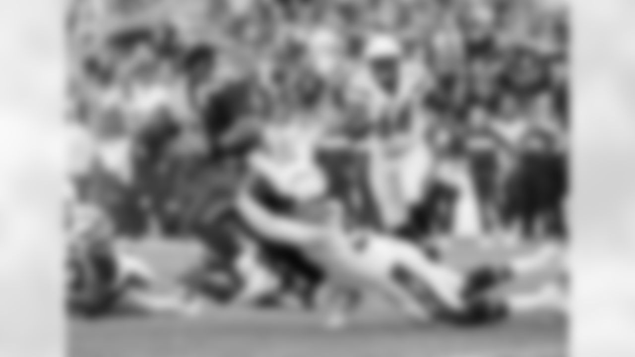 Melvin Ingram tackles Seattle Seahawks quarterback Russell Wilson at CenturyLink Field on Sunday, November 5, 2018.