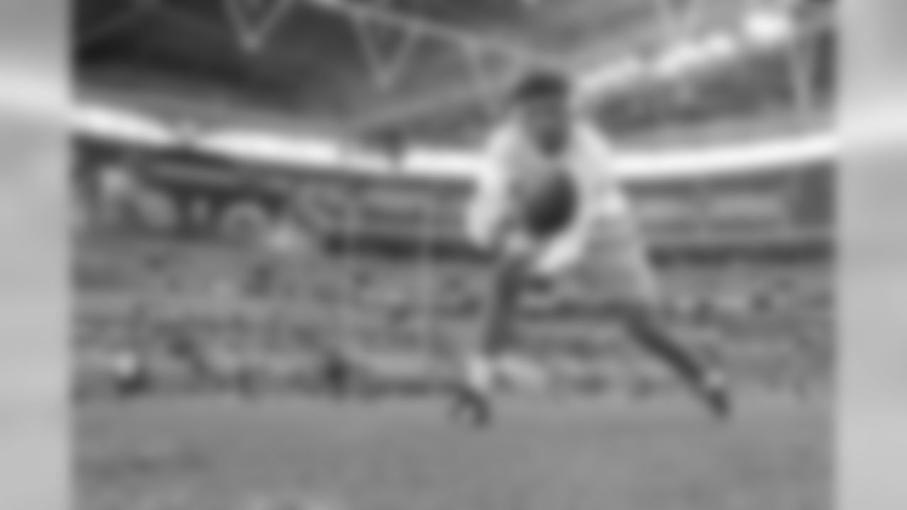 Tyrell Williams warms up at Wembley Stadium in London before the Week 7 matchup against the Tennessee Titans.