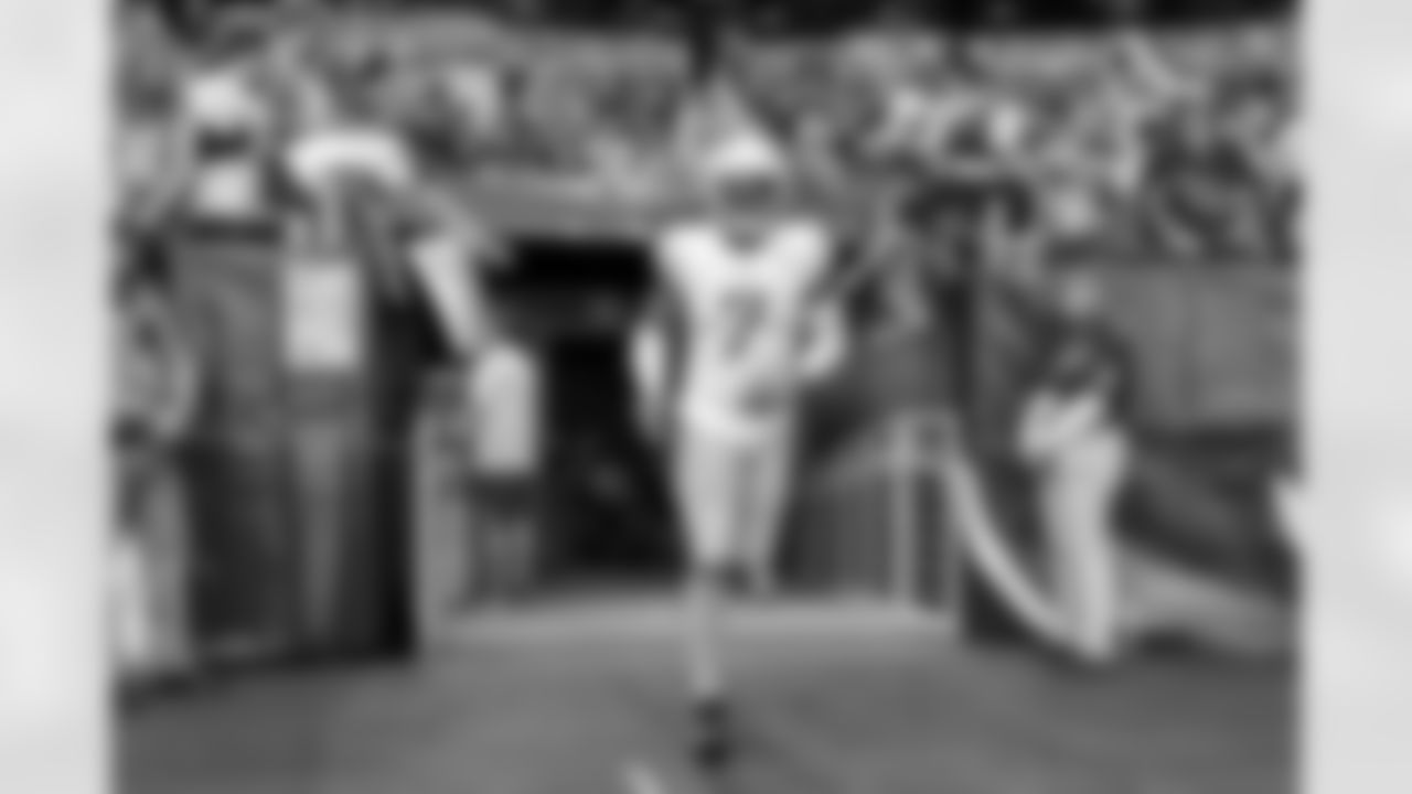 The Los Angeles Chargers prepare to play against the Arizona Cardinals at State Farm Stadium on November 27, 2022 in Glendale, Arizona.