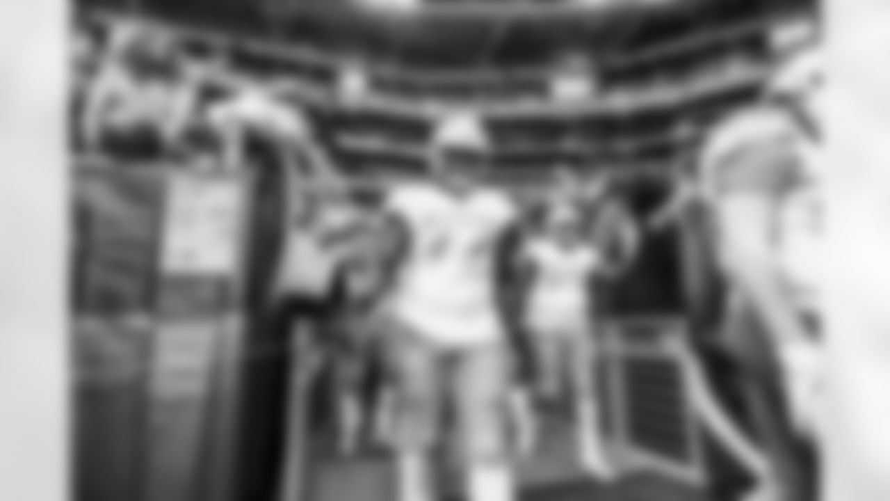 The Los Angeles Chargers prepare to play against the Arizona Cardinals at State Farm Stadium on November 27, 2022 in Glendale, Arizona.