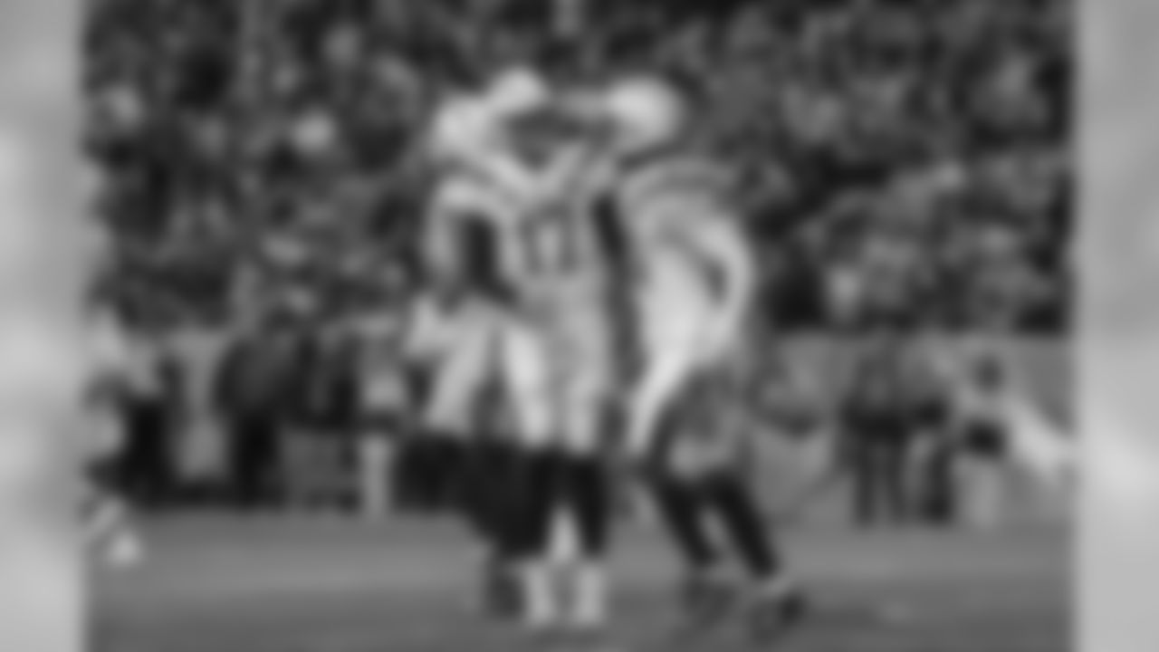 Philip River and Mike Williams celebrate Williams' touchdown during the Week 17 contest against the Denver Broncos.