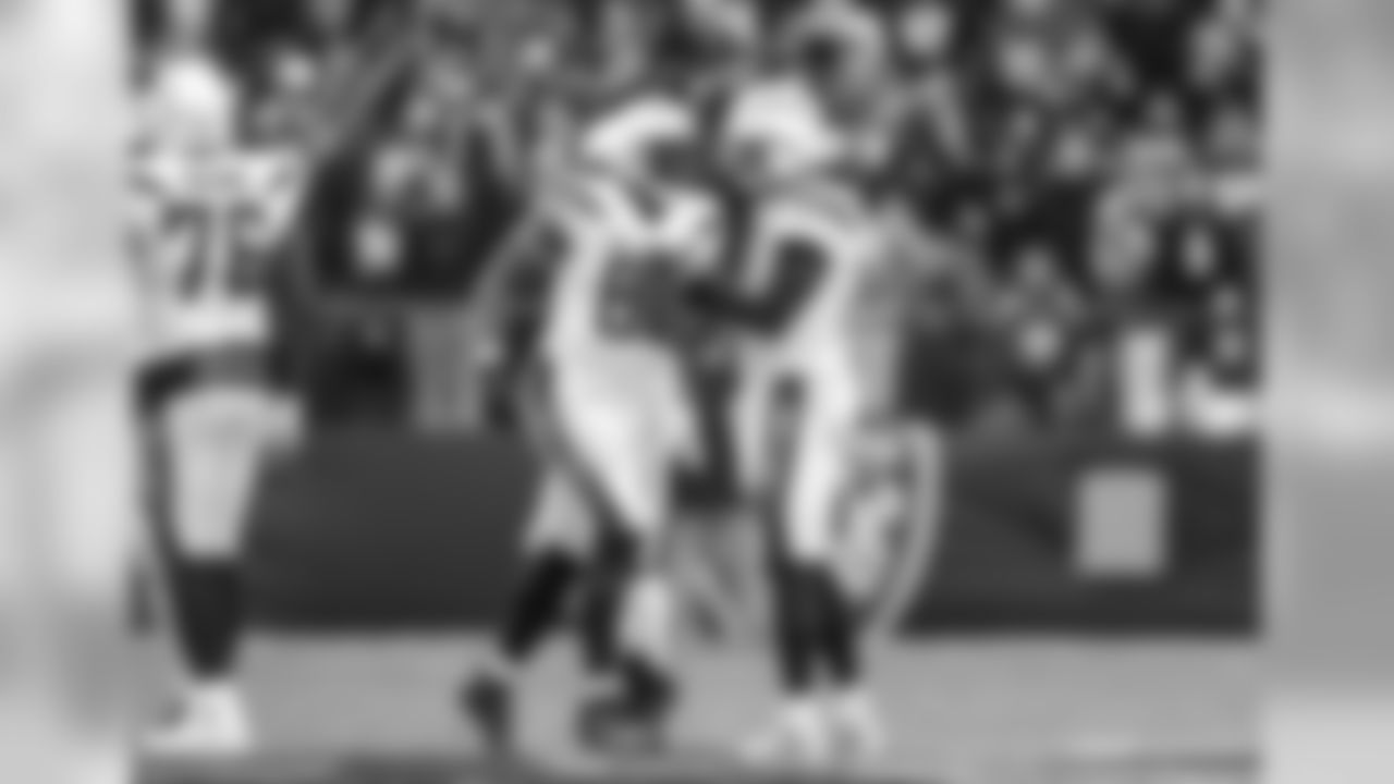 Antonio Gates and Philip Rivers celebrate a completed pass during the Wild Card matchup against the Baltimore Ravens at M&T Bank Stadium.