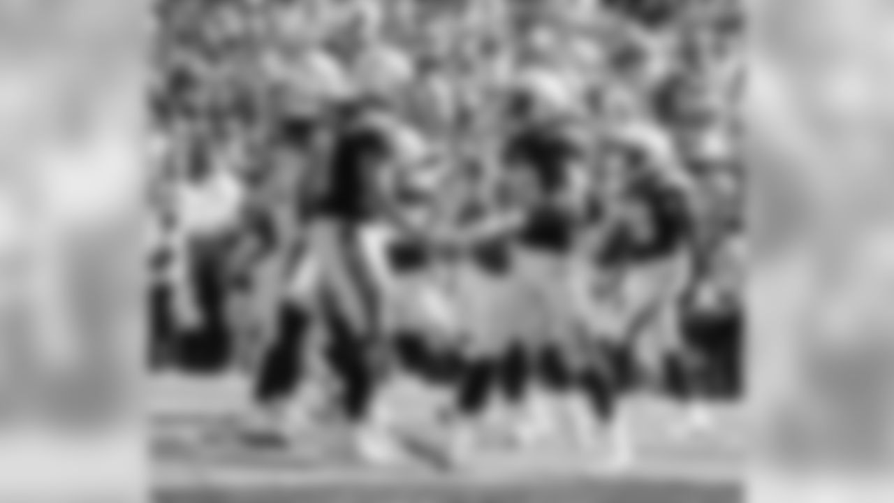 Philip Rivers congratulates Melvin Gordon on a touchdown at LA Memorial Coliseum on Sunday, September 23, 2018.