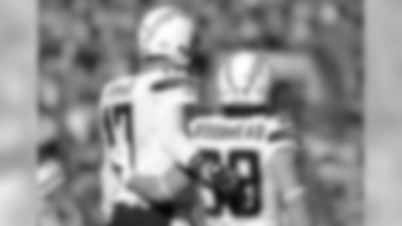 San Diego Chargers quarterback Philip Rivers (17) puts his arm around running back Danny Woodhead (39) during an AFC Divisional Playoff game against the Denver Broncos on Sunday, Jan. 12, 2014, in Denver. The Broncos won the game, 24-17. (AP Photo/Greg Trott)
