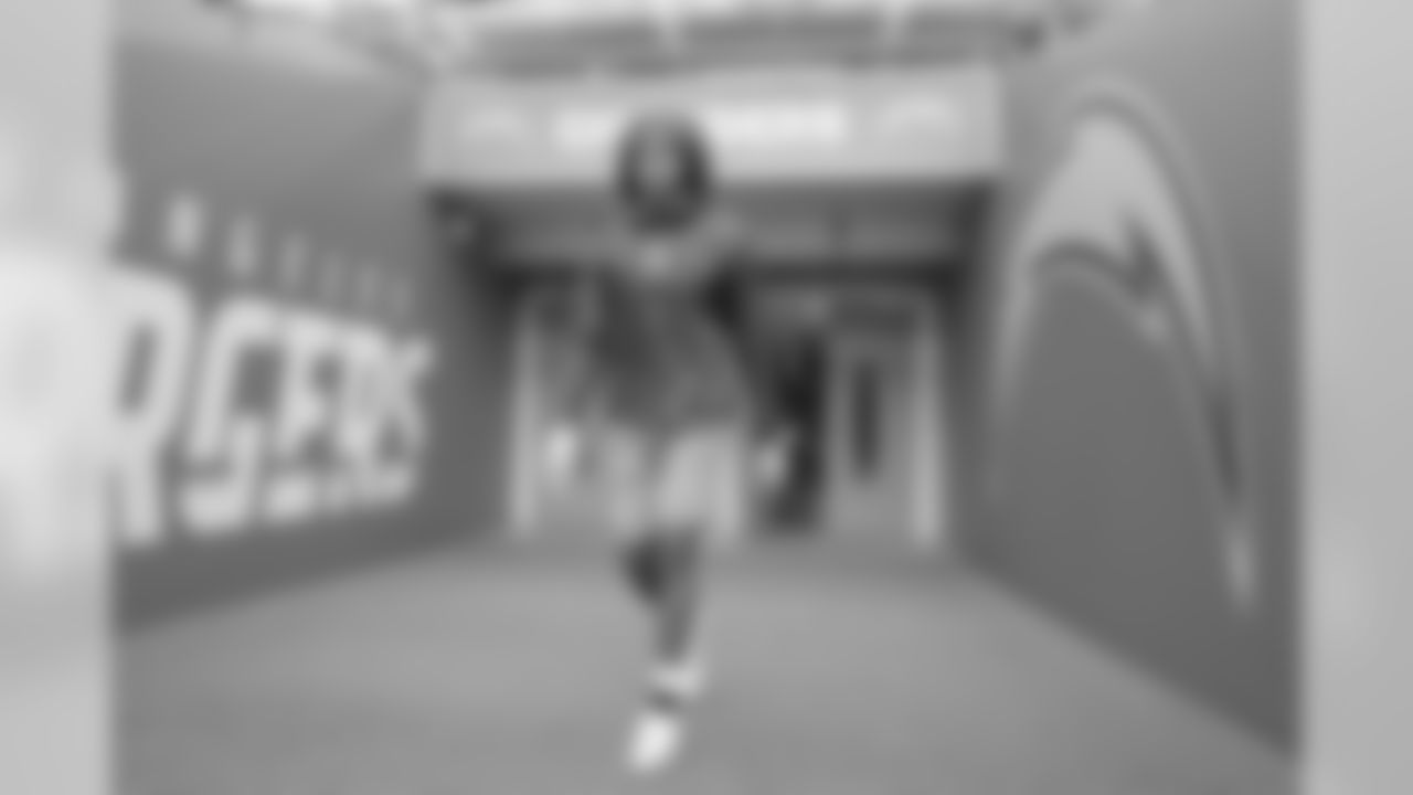 Travis Benjamin walks out to the field to warm up at Wembley Stadium in London before the Week 7 matchup against the Tennessee Titans.