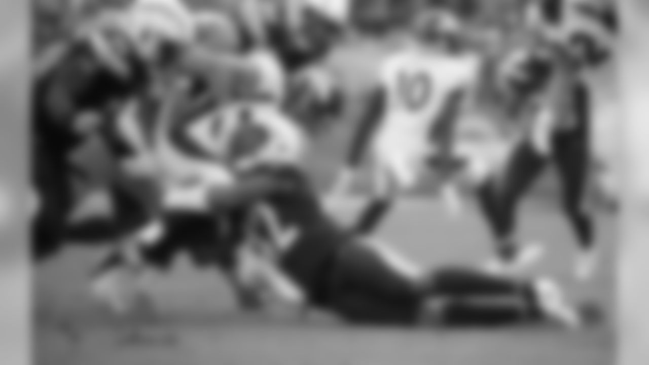 Uchenna Nwosu makes a tackle during Week 11's Salute to Service game versus the Denver Broncos on Sunday, November 18, 2018 at StubHub Center.