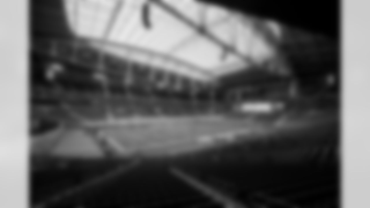 The Los Angeles Chargers prepare to play against the Arizona Cardinals at State Farm Stadium on November 27, 2022 in Glendale, Arizona.