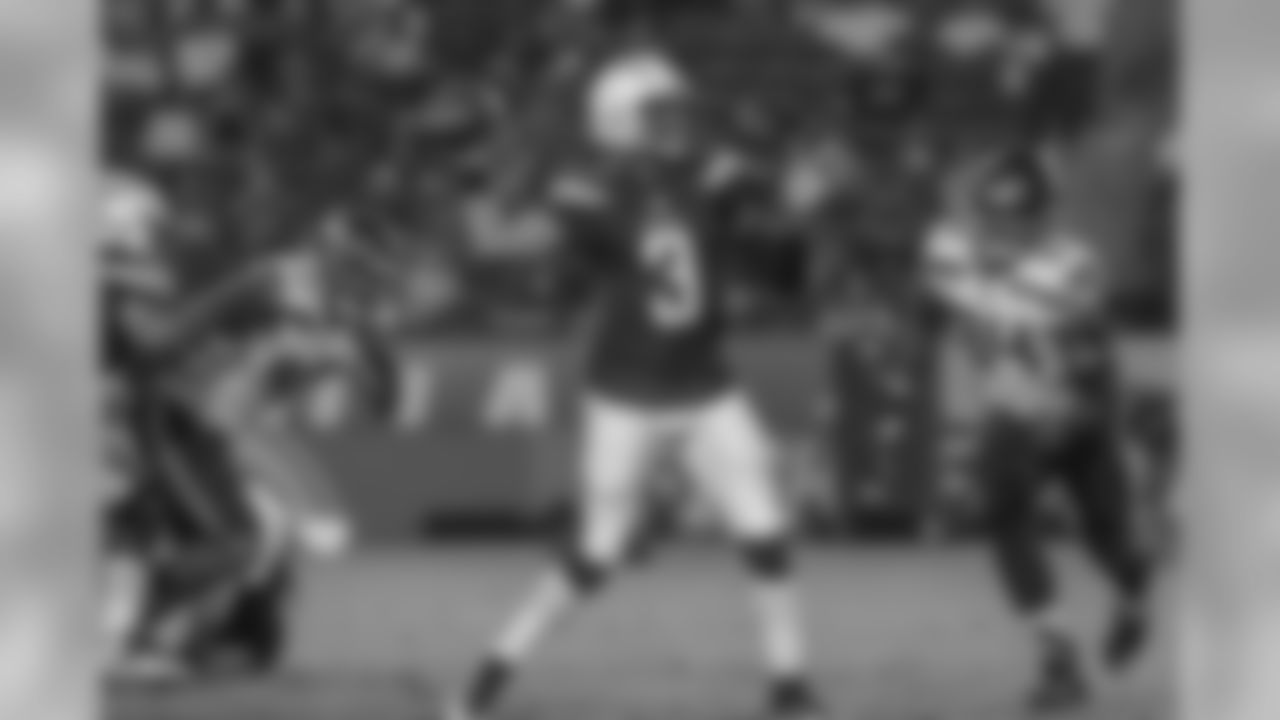 Geno Smith looks to throw the ball during the Chargers' preseason home opener against the Seattle Seahawks at ROKiT Field at StubHub Center.