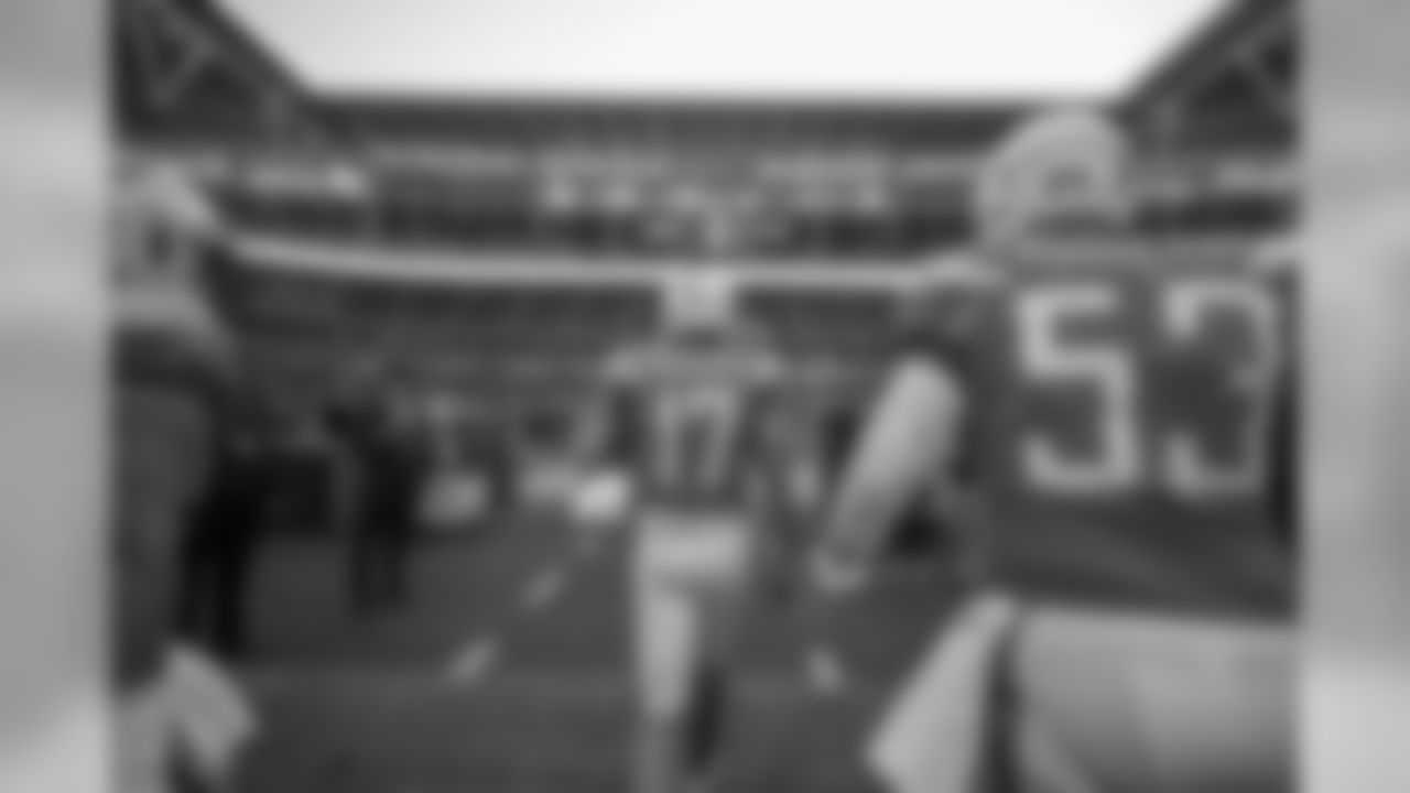 Philip Rivers and Mike Pouncey walk out to the field at Wembley Stadium in London to warm up before the Week 7 matchup against the Tennessee Titans.