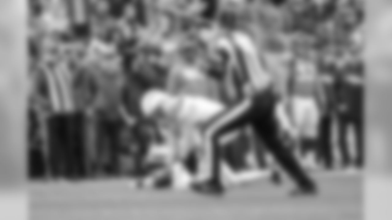 Kyle Emanuel scoops up a fumble and returns it for a touchdown during the Week 17 contest against the Denver Broncos.