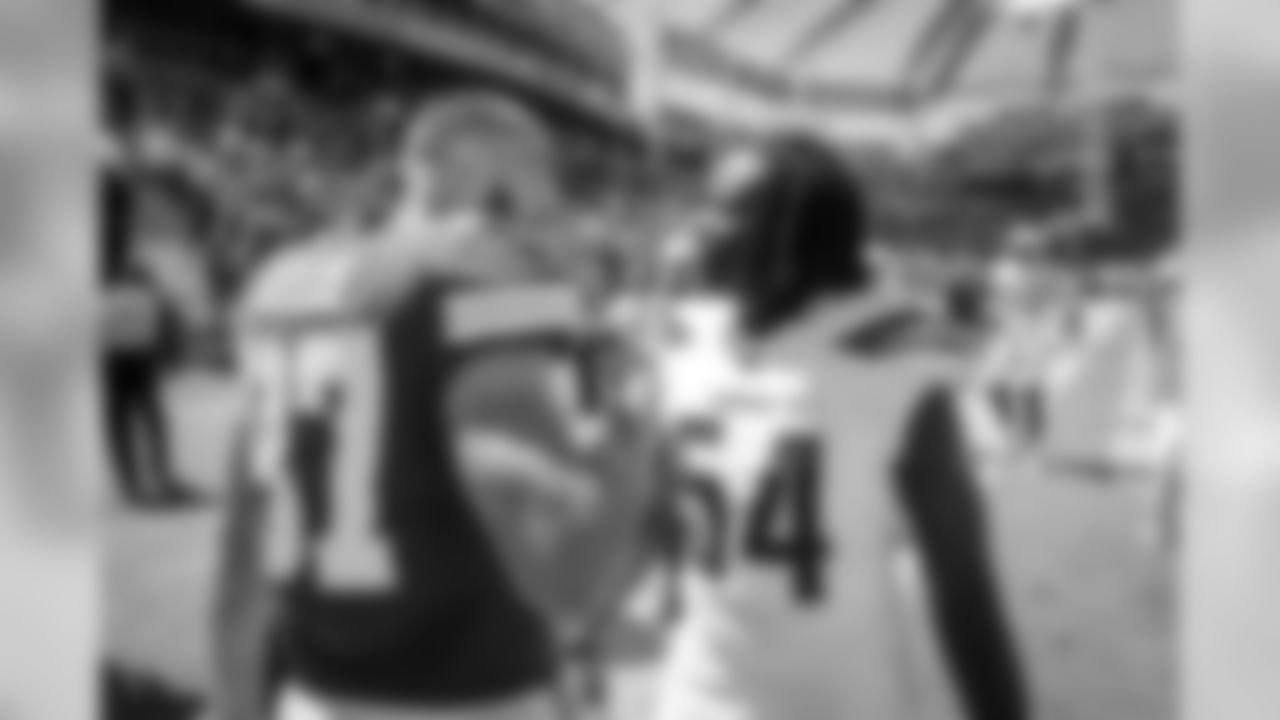 Melvin Ingram and Travis Kelce share a handshake before the Bolts face-off against the Kansas City Chiefs in the season opener from ROKiT Field at StubHub Center.
