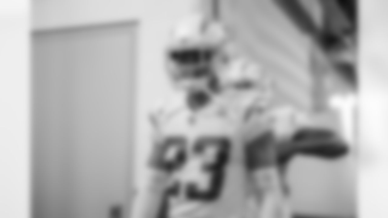 The Los Angeles Chargers prepare to play against the Arizona Cardinals at State Farm Stadium on November 27, 2022 in Glendale, Arizona.
