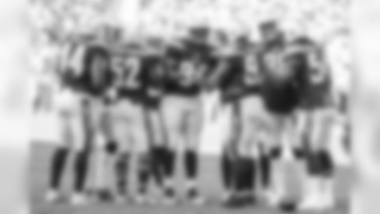 The defensive line huddles up during the Bolts' third preseason game against the New Orleans Saints at ROKiT Field at StubHub Center.