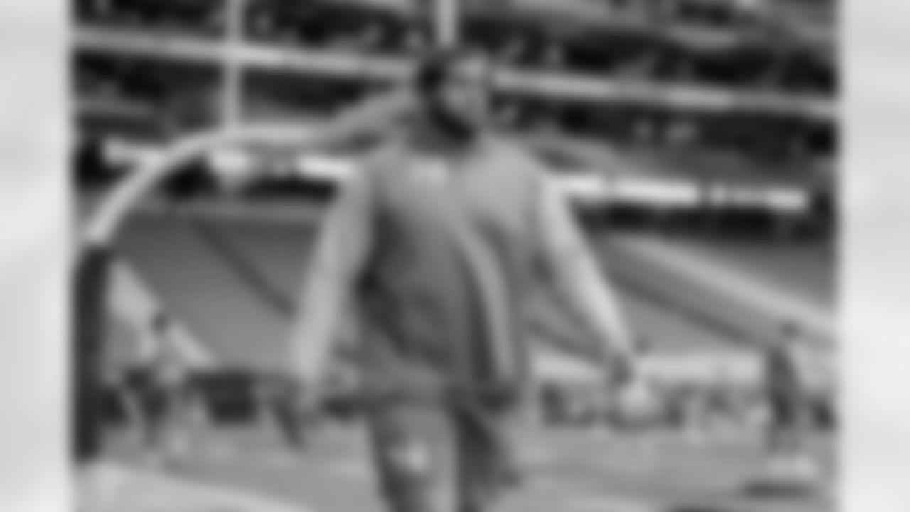 The Los Angeles Chargers prepare to play against the Arizona Cardinals at State Farm Stadium on November 27, 2022 in Glendale, Arizona.