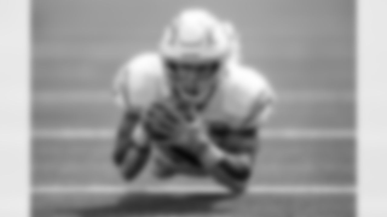 Ekeler Hovers - Austin Ekeler is known for being pound-for-pound the strongest player on the team, but here, he looks light as a feather as he corrals the football and hovers inches off the ground. The magic of photography. - Mike Nowak/Los Angeles Chargers