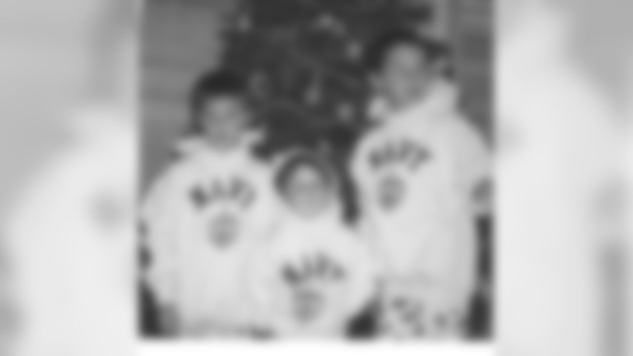 Scot Quessenberry with his brothers Paul and David.