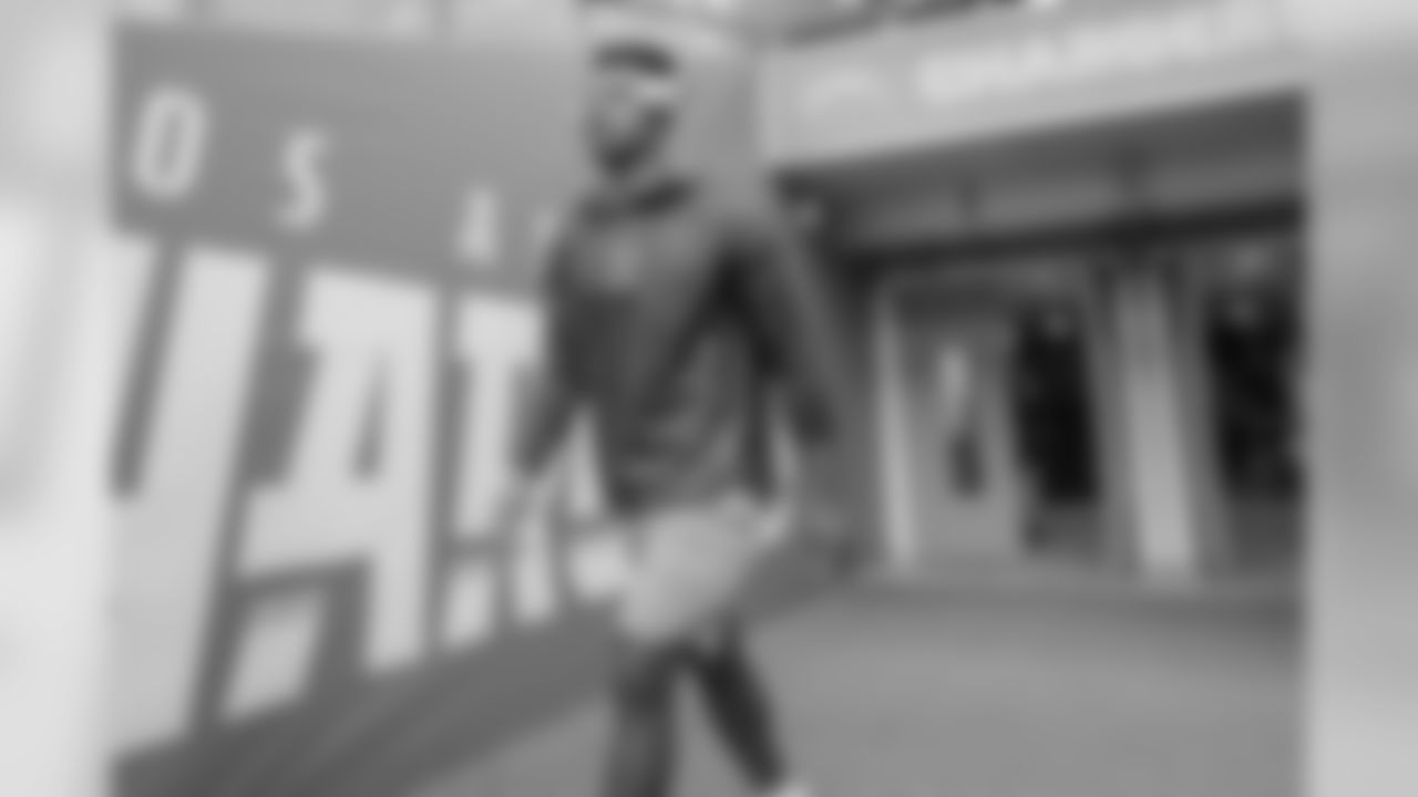 Justin Jackson walks out to the field to warm up at Wembley Stadium in London before the Week 7 matchup against the Tennessee Titans.