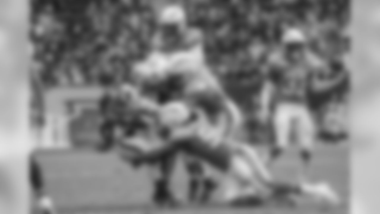 Melvin Ingram and Kyle Emanuel tackle Raiders RB Marshawn Lynch during the Bolts' Week 5 matchup against the Oakland Raiders at ROKiT Field at StubHub Center.