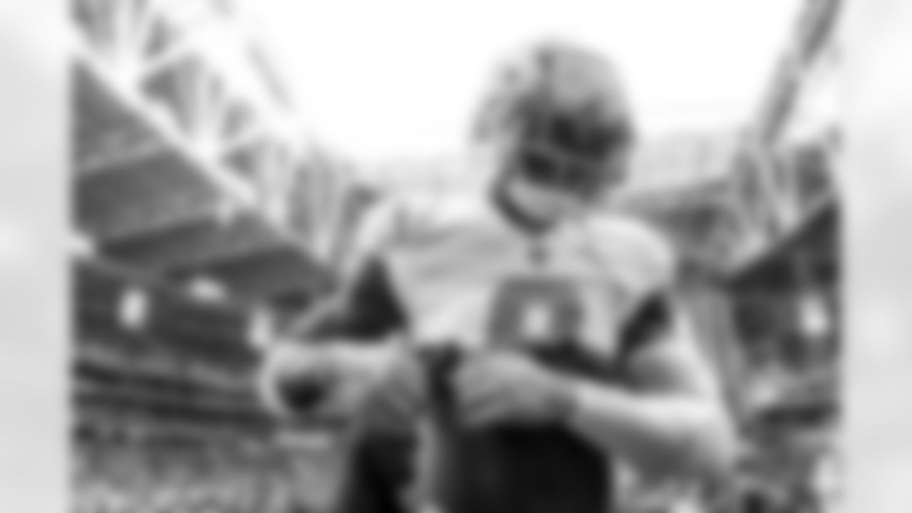 The Los Angeles Chargers prepare to play against the Arizona Cardinals at State Farm Stadium on November 27, 2022 in Glendale, Arizona.