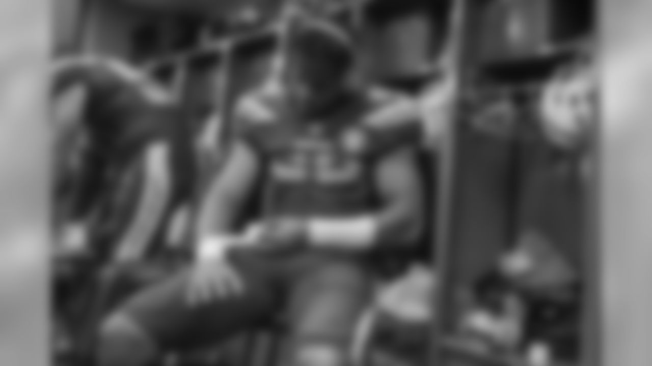 Tre'Von Johnson gets ready in the locker room before the Week 12 matchup against the Arizona Cardinals.
