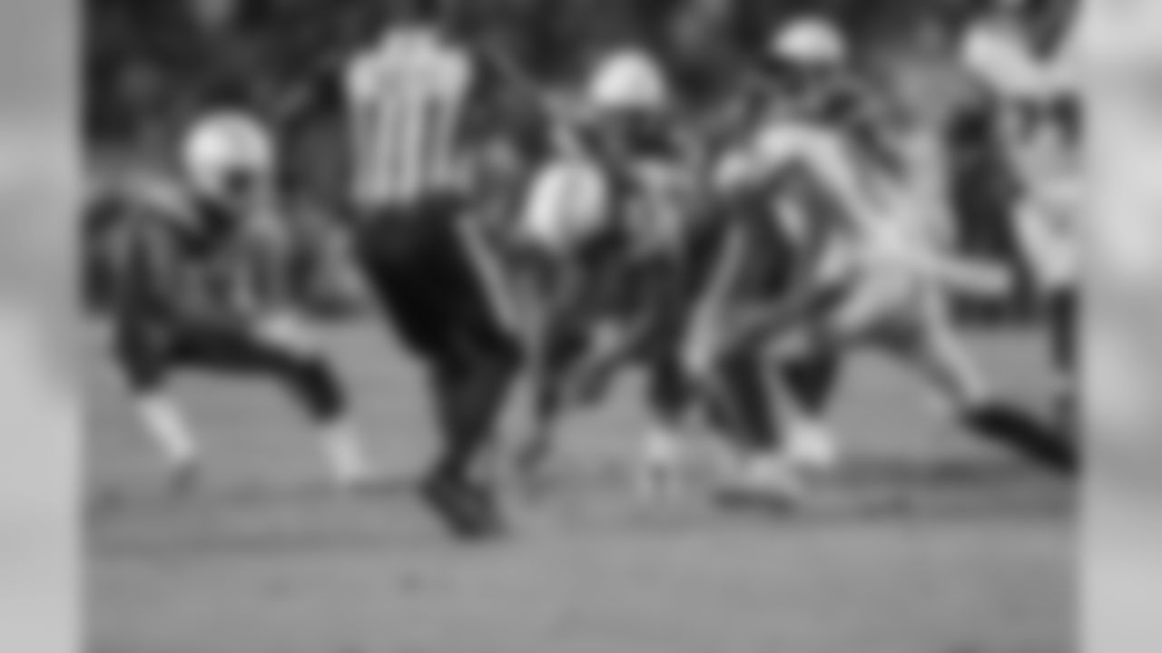 Melvin Ingram recovers a fumble during the Week 16 matchup against the Baltimore Ravens at ROKiT Field at StubHub Center.