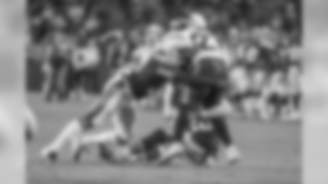 Adrian Phillips tackles Seattle RB Mike Davis during the Chargers' preseason home opener against the Seattle Seahawks at ROKiT Field at StubHub Center.