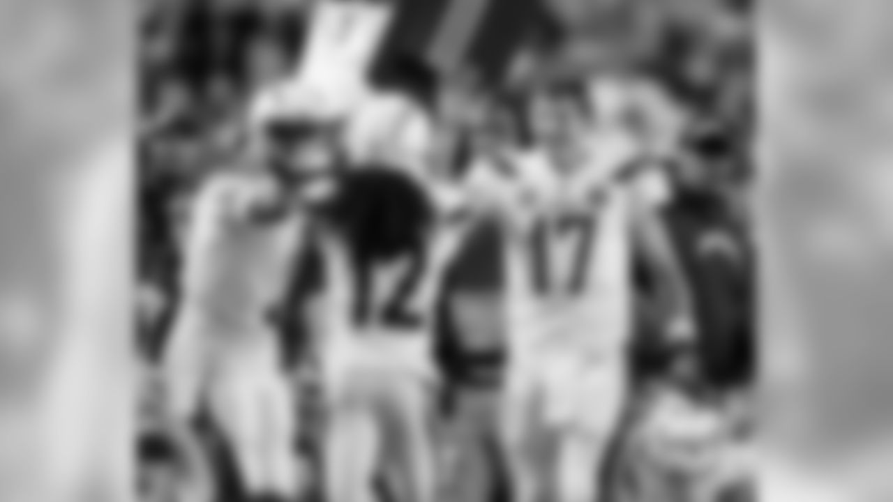 Travis Benjamin and Philip Rivers celebrating after the touchdown drive during the Week 13 matchup against the Pittsburgh Steelers.