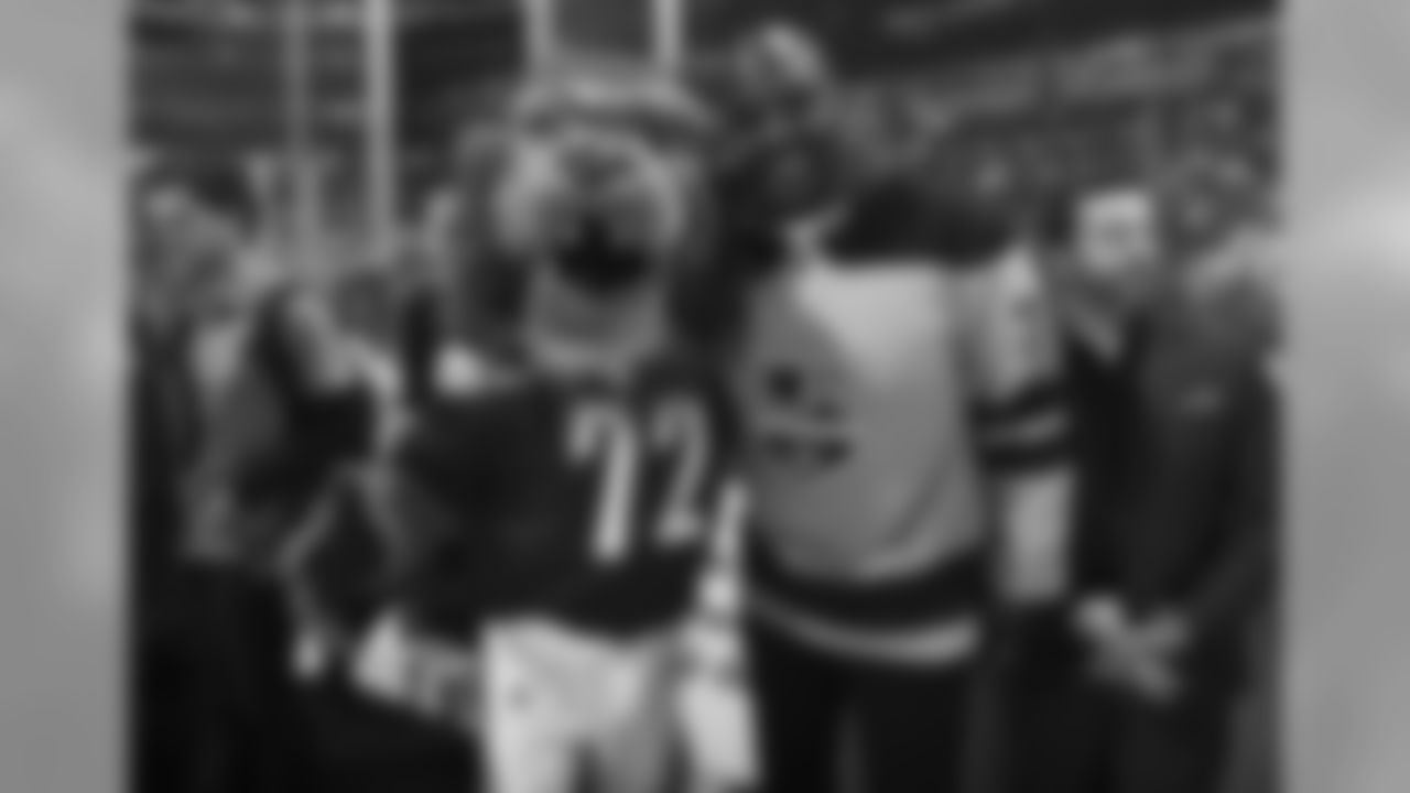 Los Angeles Kings mascot Bailey and Chargers Legend Marcellus Wiley pose while waiting for a ceremonial during the Winnipeg Jets vs. Kings game on December 18, 2018 at STAPLES Center.