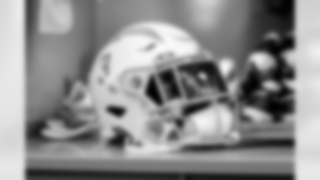 The Los Angeles Chargers prepare to play against the Arizona Cardinals at State Farm Stadium on November 27, 2022 in Glendale, Arizona.