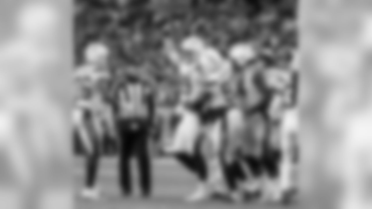 Joey Bosa celebrates after recovering a forced fumble against the Denver Broncos at Broncos Stadium at Mile High on Sunday, Dec. 30, 2018