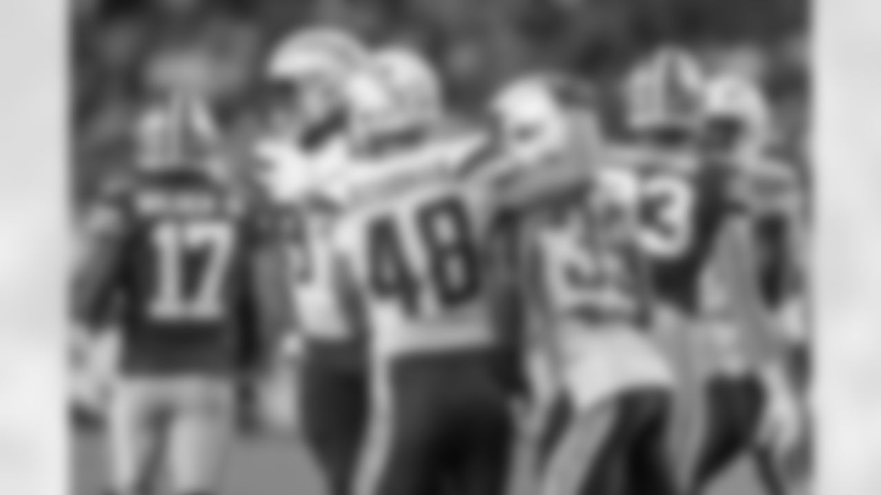 Nick Dzubnar celebrates with Tony Brown after Brown's fumble recovery against the San Francisco 49ers during the last preseason game.